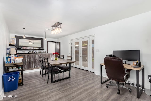 dining area featuring wood-type flooring and french doors