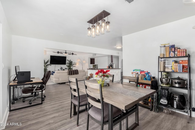 dining area with wood-type flooring