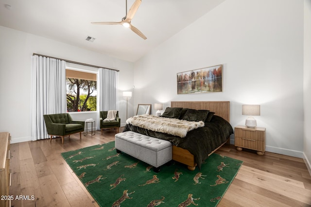 bedroom with high vaulted ceiling, hardwood / wood-style floors, and ceiling fan