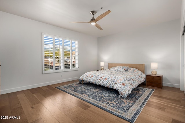 bedroom featuring ceiling fan and wood-type flooring