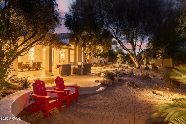 patio terrace at dusk with an outdoor hangout area