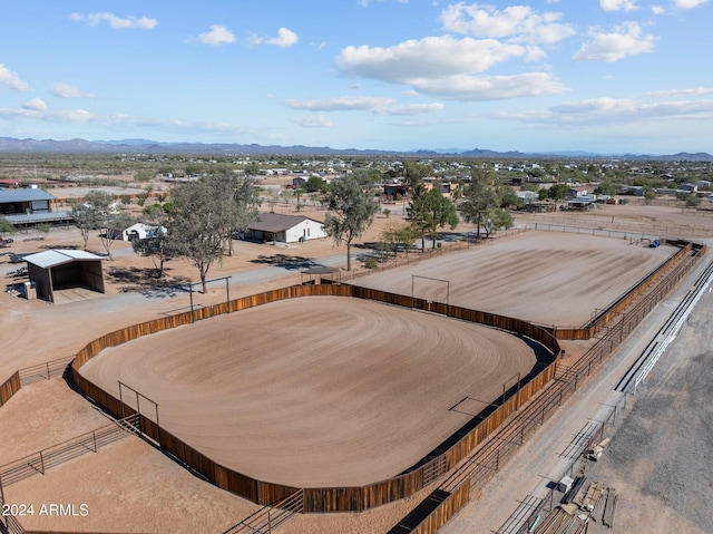 birds eye view of property featuring a mountain view