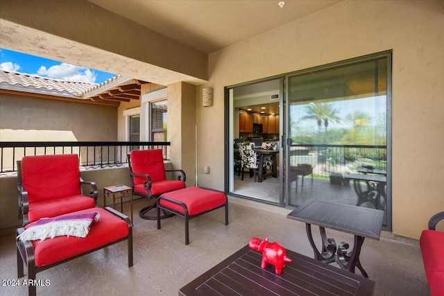 view of patio / terrace with a balcony