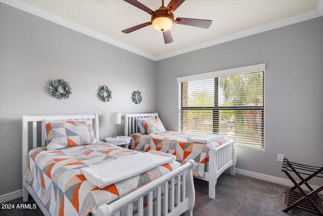 bedroom featuring a ceiling fan, baseboards, carpet, and crown molding