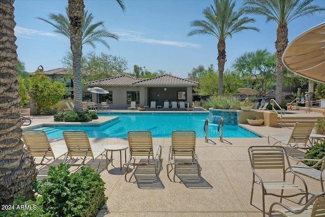 pool featuring a patio area