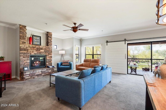 carpeted living area featuring a stone fireplace, crown molding, and ceiling fan