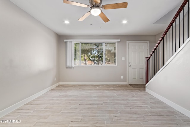 entryway with light hardwood / wood-style flooring and ceiling fan