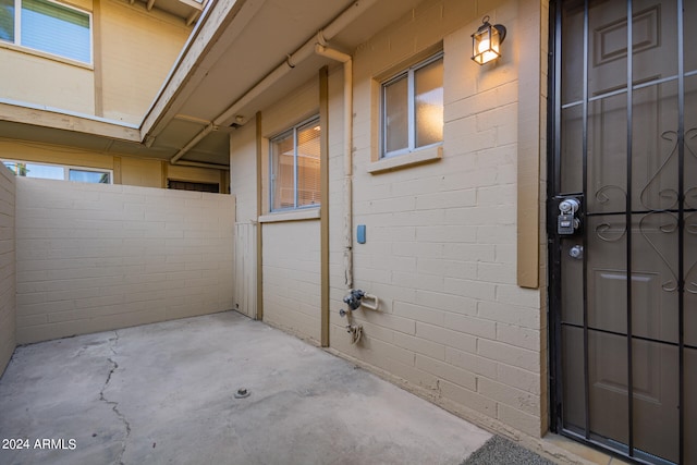 doorway to property featuring a patio area