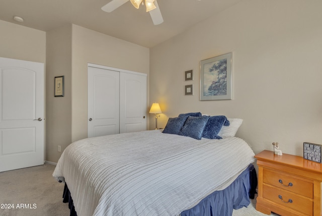 bedroom featuring light carpet, a closet, and ceiling fan