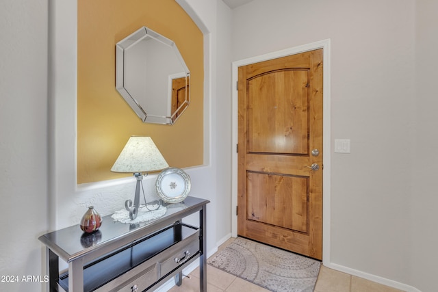 entryway with light tile patterned flooring