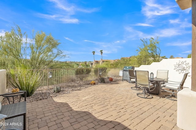 view of patio with a grill