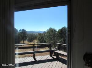 wooden terrace with a mountain view