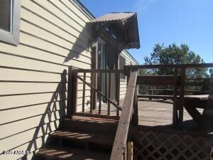 view of side of property with a wooden deck