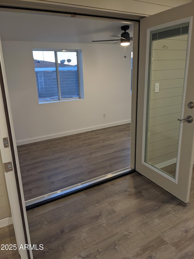 interior space featuring hardwood / wood-style floors and ceiling fan