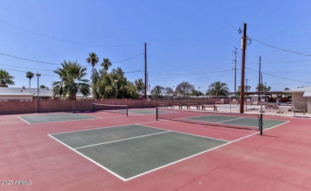 view of tennis court with basketball hoop