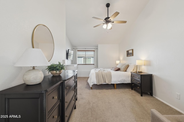 bedroom featuring vaulted ceiling, light carpet, baseboards, and a ceiling fan