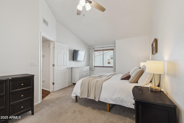 bedroom with vaulted ceiling, carpet flooring, and ceiling fan