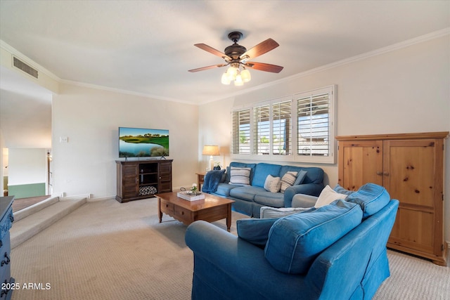 living room with light colored carpet, a ceiling fan, ornamental molding, and baseboards