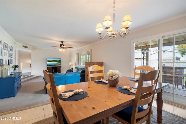 dining area with ornamental molding, light tile patterned floors, a chandelier, and ceiling fan