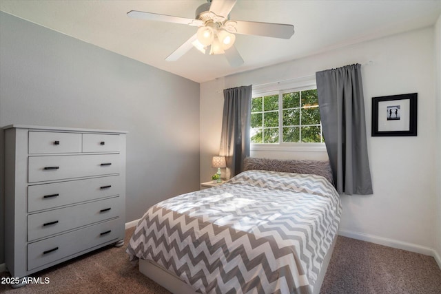 bedroom with dark colored carpet, baseboards, and a ceiling fan