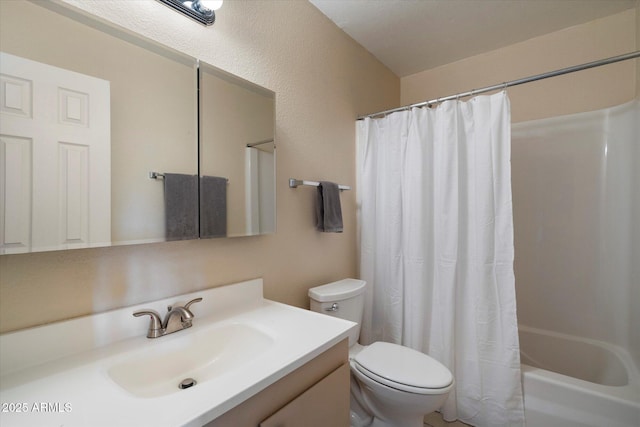 bathroom featuring toilet, vanity, and shower / bath combo with shower curtain