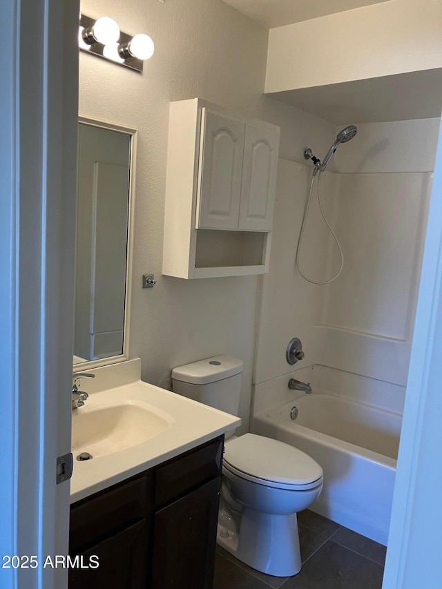 full bathroom with tile patterned floors, toilet, bathing tub / shower combination, and vanity