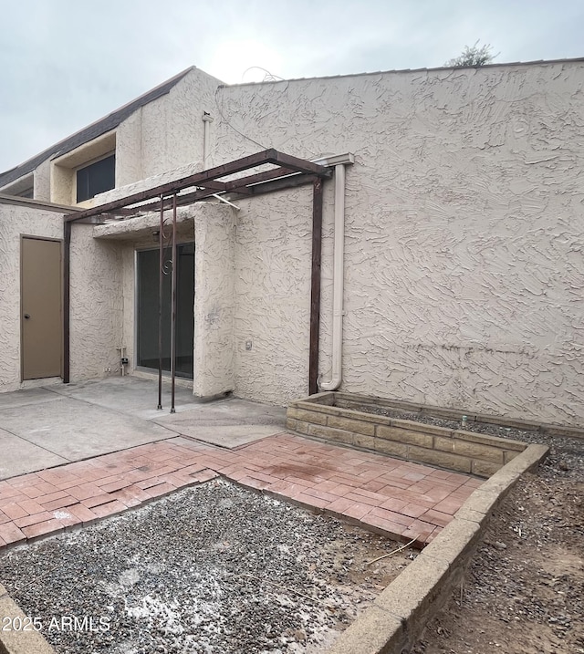 rear view of property with a patio