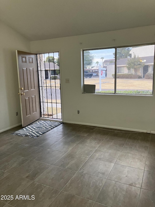 foyer entrance with tile patterned flooring