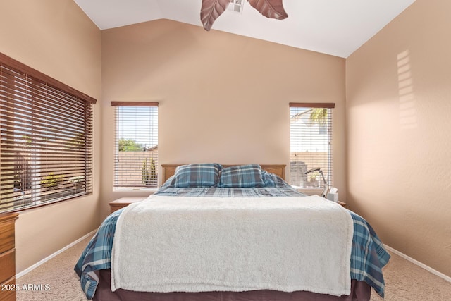 carpeted bedroom featuring baseboards, visible vents, multiple windows, and lofted ceiling