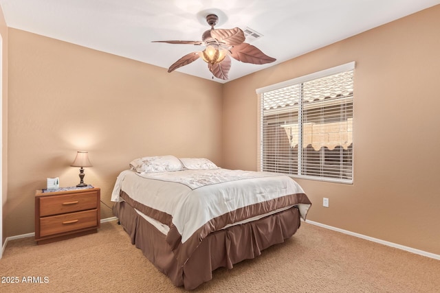bedroom featuring light colored carpet, visible vents, ceiling fan, and baseboards