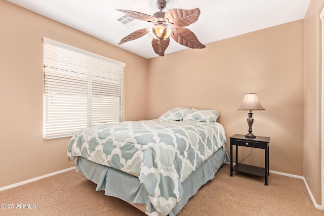 carpeted bedroom featuring ceiling fan, visible vents, and baseboards