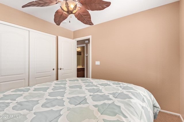 bedroom featuring ceiling fan, baseboards, carpet flooring, and a closet