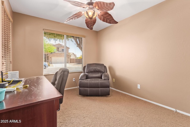 home office featuring baseboards, ceiling fan, and carpet flooring