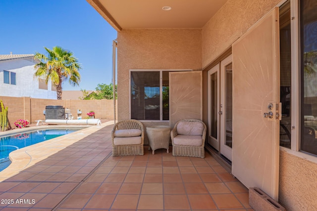 view of patio with a fenced in pool and a fenced backyard