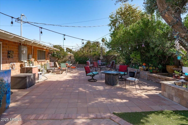 view of patio / terrace with a fire pit