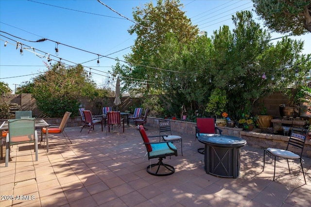 view of patio / terrace featuring a fire pit