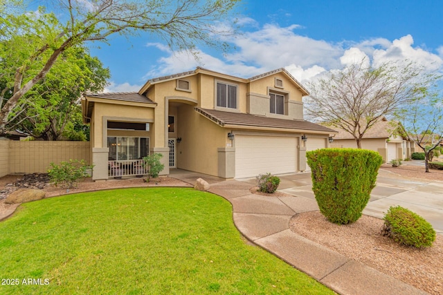 view of front of property featuring concrete driveway, a tiled roof, fence, a front lawn, and stucco siding