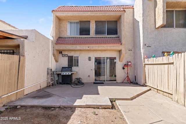 6345 N 49th Ave, Glendale, AZ 85301 - back of property with a fenced backyard, a tiled roof, and stucco siding