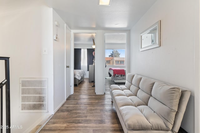 6345 N 49th Ave, Glendale, AZ 85301 - living room featuring dark wood-style flooring, visible vents, and baseboards
