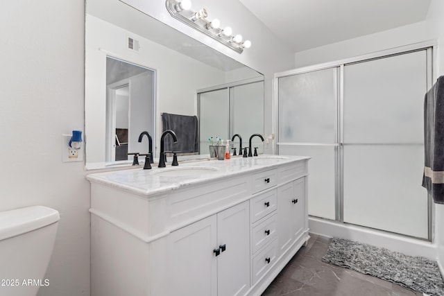 6345 N 49th Ave, Glendale, AZ 85301 - bathroom featuring a stall shower, visible vents, and a sink