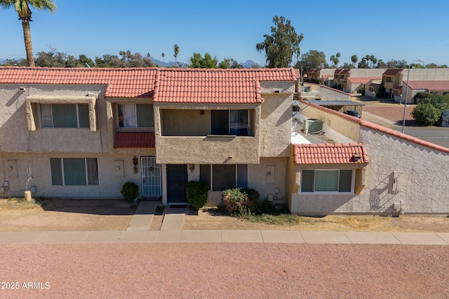 6345 N 49th Ave, Glendale, AZ 85301 - view of front of property featuring a balcony, a tile roof, and stucco siding
