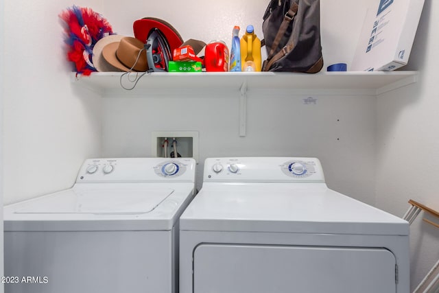 washroom with washing machine and dryer