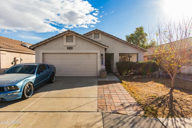 ranch-style home featuring a garage