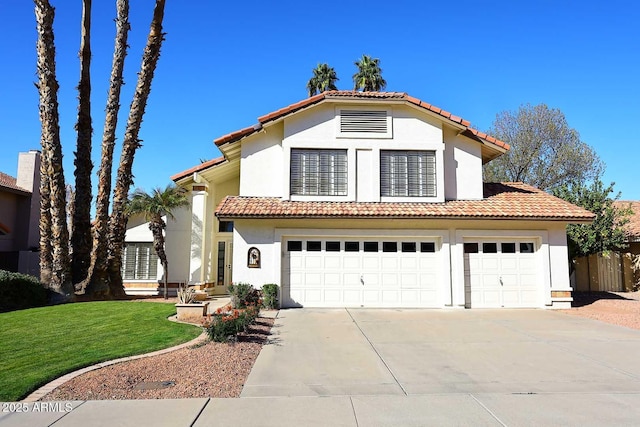 mediterranean / spanish-style house with a tiled roof, a front yard, concrete driveway, and stucco siding