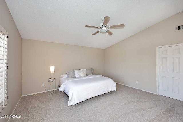 bedroom with lofted ceiling, carpet flooring, a ceiling fan, and baseboards