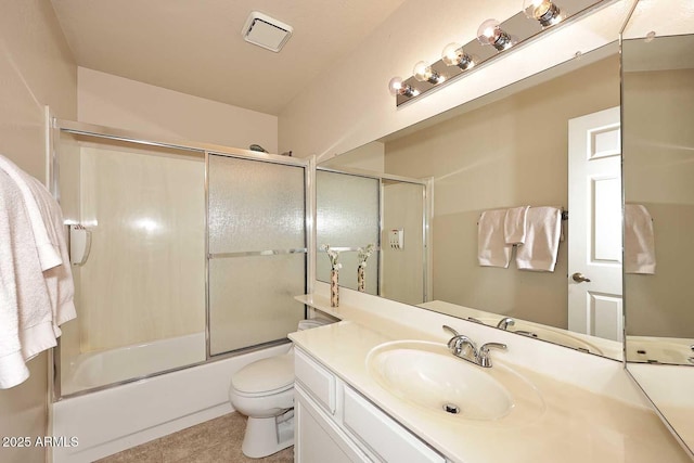 full bath with visible vents, bath / shower combo with glass door, toilet, tile patterned floors, and vanity