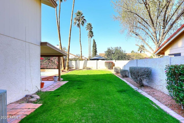 view of yard featuring a fenced backyard