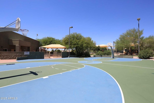 view of basketball court with community basketball court, fence, and a gazebo