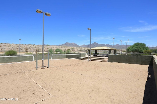 view of community featuring a gazebo, volleyball court, and a mountain view