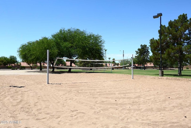 view of home's community featuring volleyball court